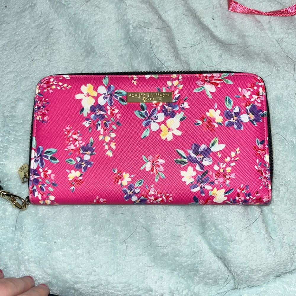 This clutch is super cute and holds many credit cards.